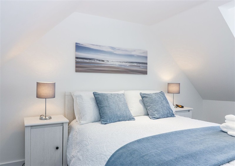 This is a bedroom at Sea Breeze St Combs, St Combs