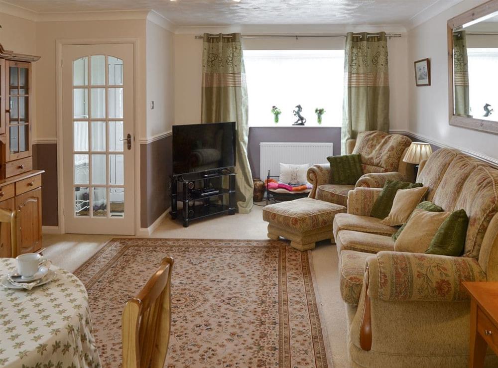 Living room/dining room at Sea Breeze in Walcott, near Norwich, Norfolk