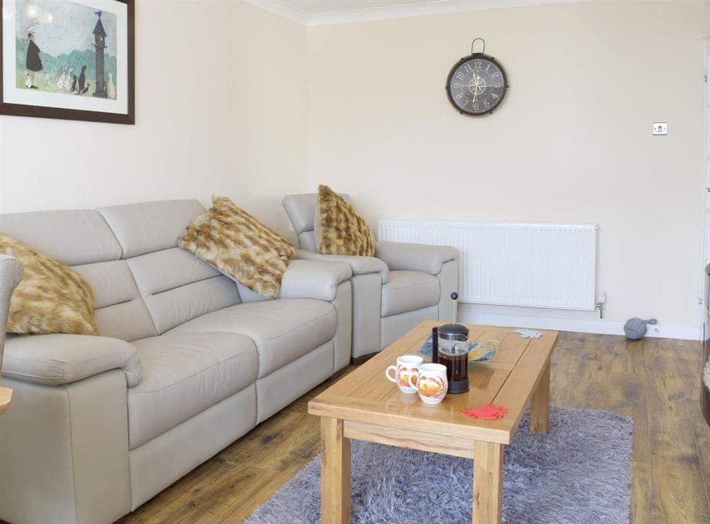 Comfortable seating within living room at Sea Dreams in Saundersfoot, Dyfed