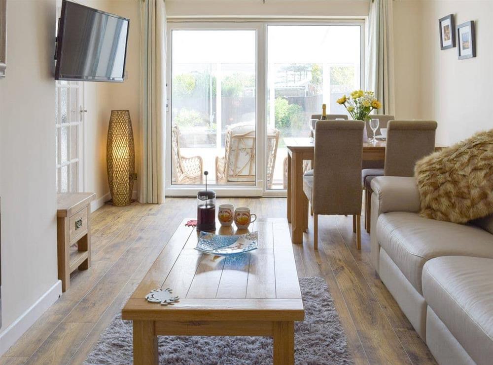 Welcoming living and dining room at Sea Dreams in Saundersfoot, Dyfed