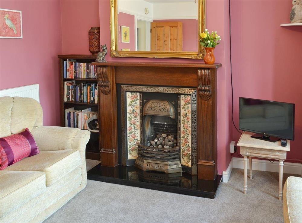 Feature fireplace in living room at Sea Folly in Brightlingsea, Essex