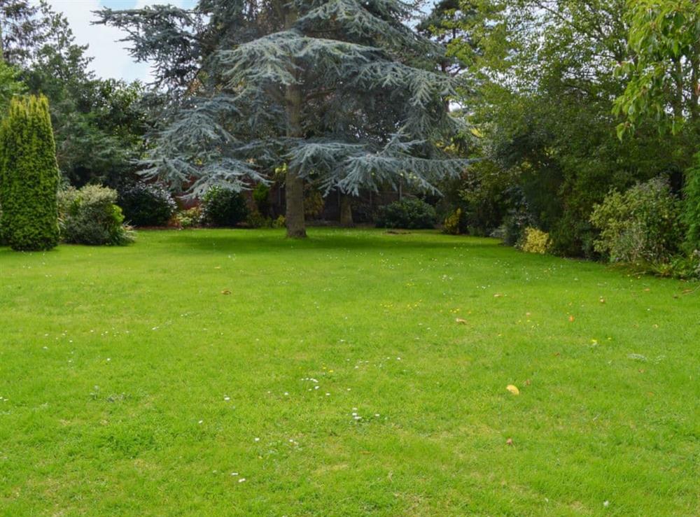 Large lawned garden at Sea Glimpse in West Runton, near Sheringham, Norfolk