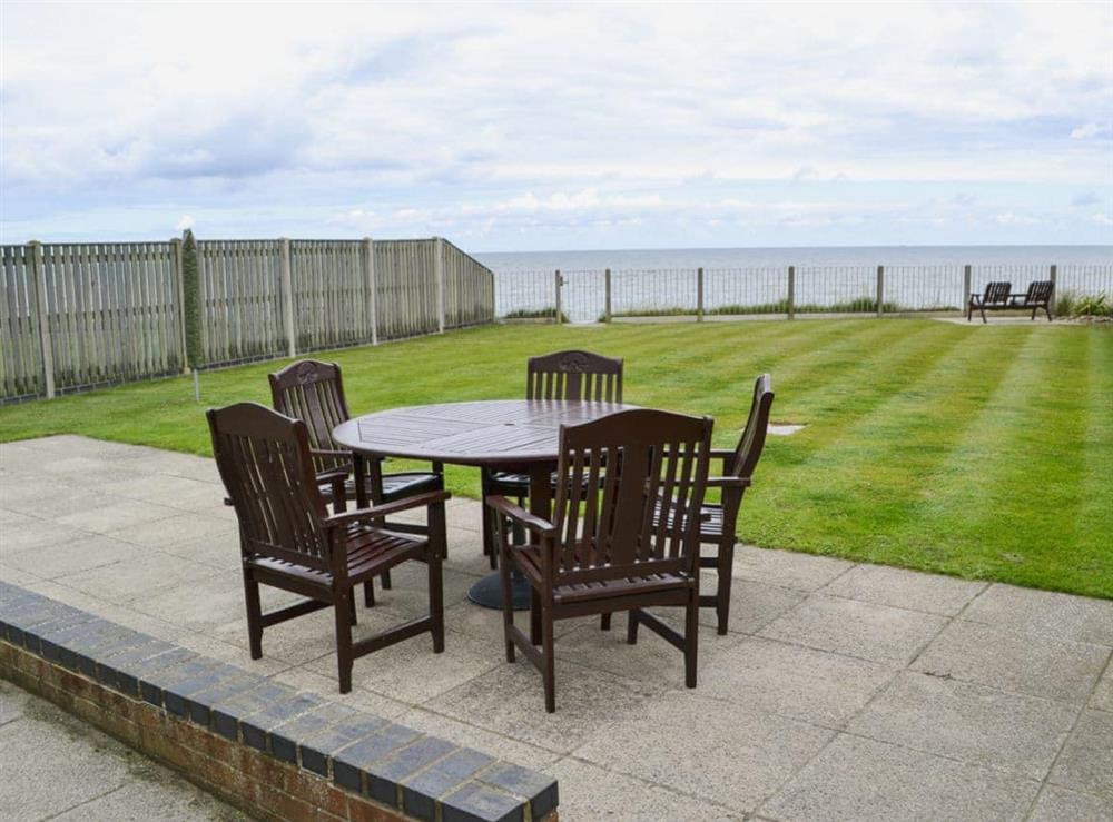 Enclosed garden with patio and furniture (photo 2) at Sea Haven in Bacton, Norfolk