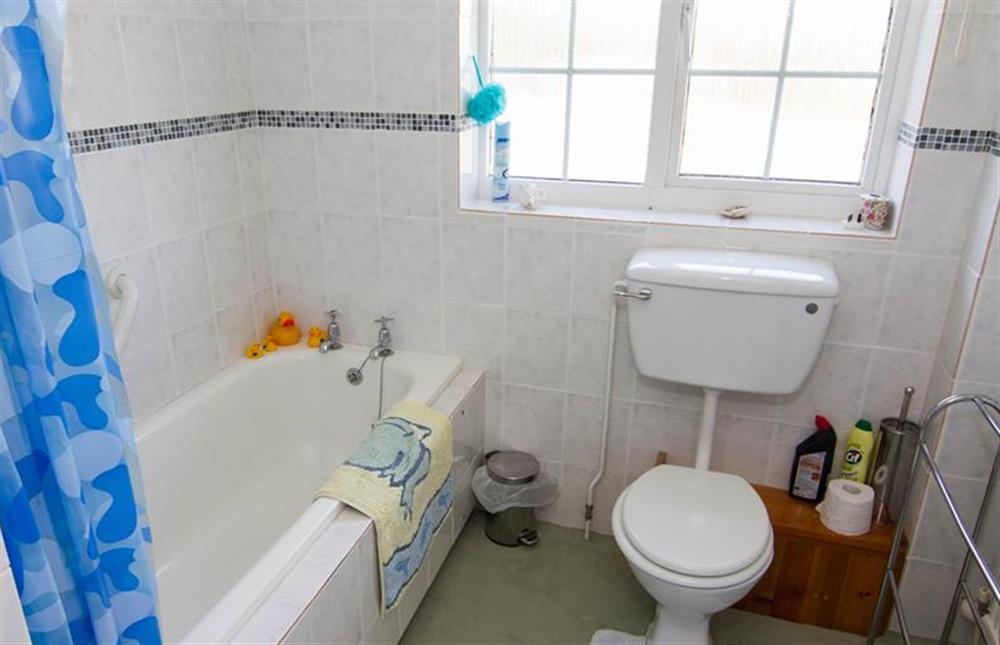 First floor: Family bathroom with shower over at Sea Holly, Brancaster Staithe near Kings Lynn