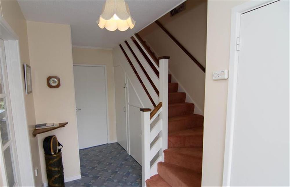 Ground floor: Hallway with stairs to first floor at Sea Holly, Brancaster Staithe near Kings Lynn