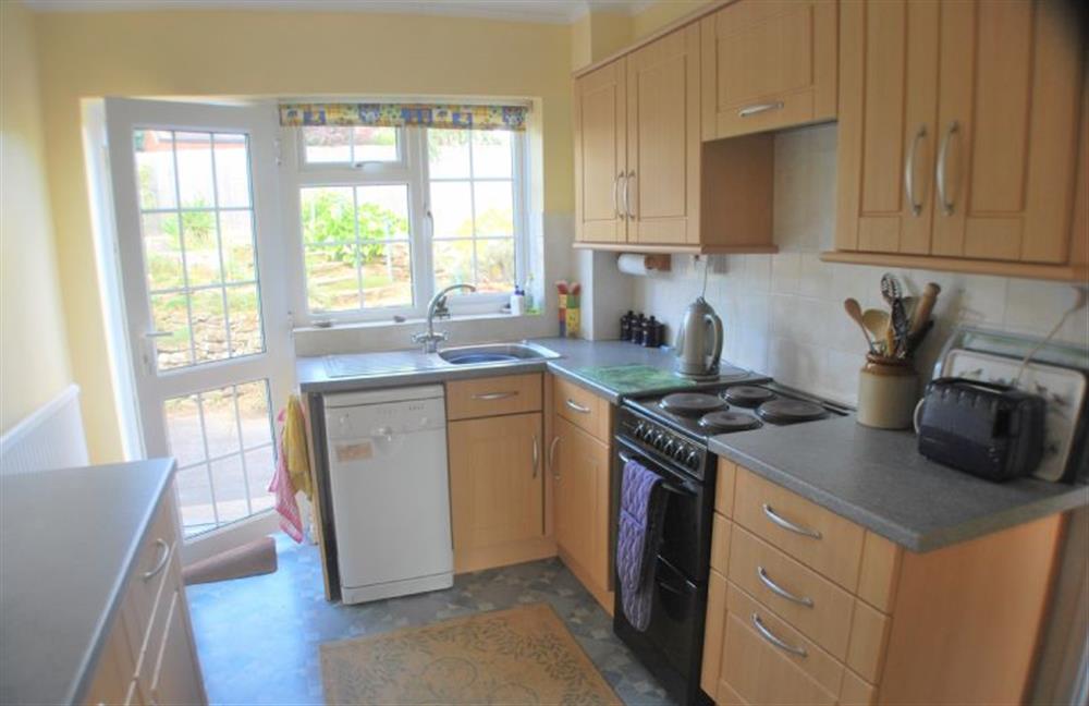 Ground floor: Kitchen with back door into garden at Sea Holly, Brancaster Staithe near Kings Lynn