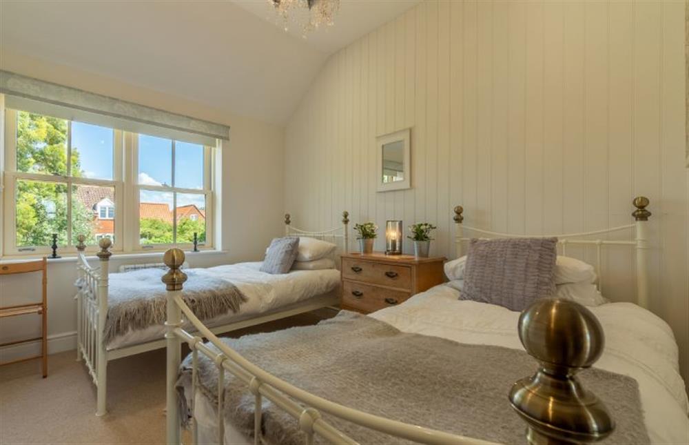 First floor: Bedroom three, twin single beds at Sea Holly Cottage, Thornham near Hunstanton