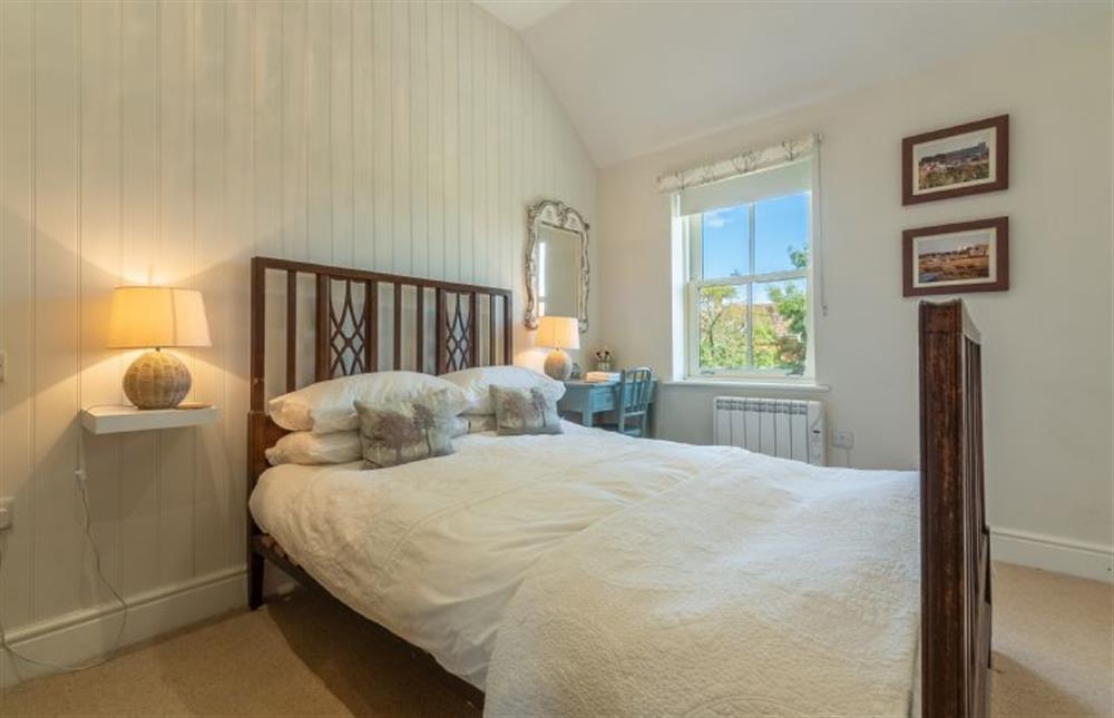 First floor: Bedroom two, Double bed at Sea Holly Cottage, Thornham near Hunstanton