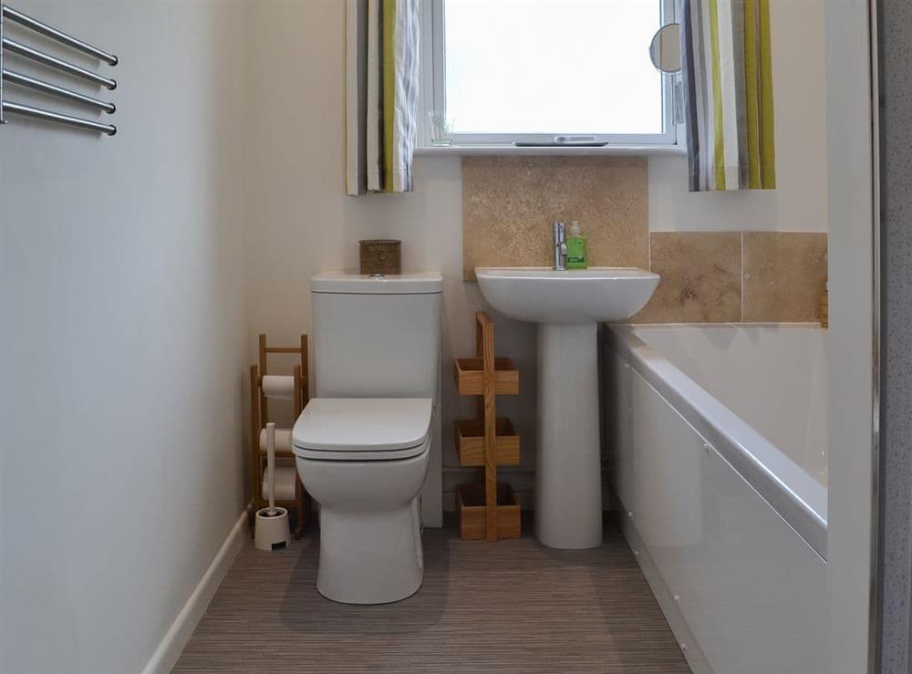 Bathroom with bath, shower cubicle and toilet at Sea La Vie in Mundesley, near North Walsham, Norfolk