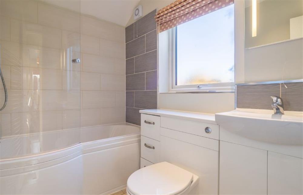 Bathroom with shower over bath at Sea Lodge, Brancaster near Kings Lynn