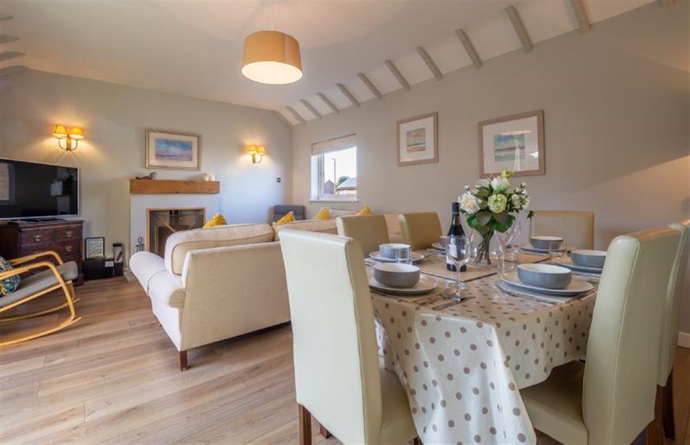 Dining table for six in the sitting room at Sea Lodge, Brancaster near Kings Lynn