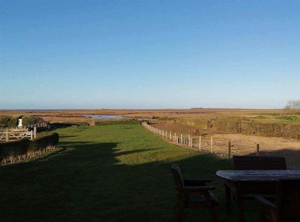 Far reaching views over the garden and slat marsh beyond at Vista Cottage, 