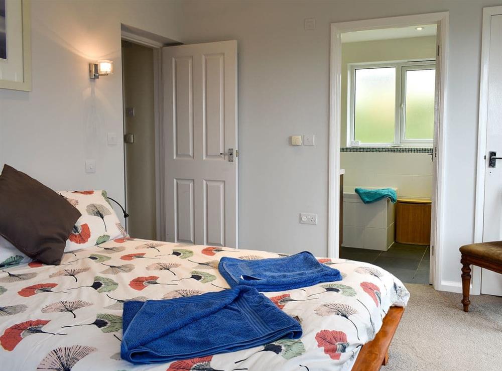 Comfortable double bedroom with Juliet balcony and en-suite (photo 3) at Sea Otter in Porthtowan, Cornwall