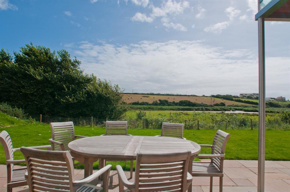 Large garden and terrace with table and chairs at Sea Peep in Whimbrels Edge, Thurlestone