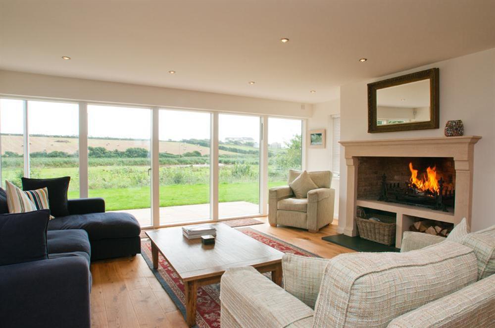Stunning sitting room with large open fireplace at Sea Peep in Whimbrels Edge, Thurlestone