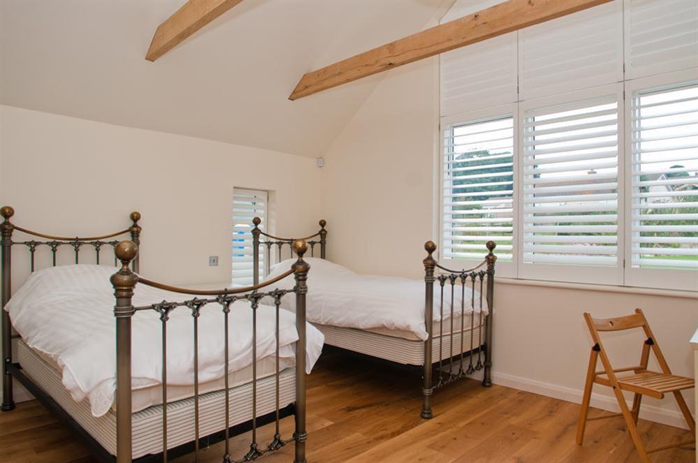Twin room on the first floor, also with en suite shower room at Sea Peep in Whimbrels Edge, Thurlestone