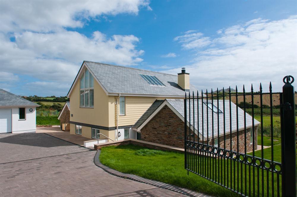 Wrought iron gates into spacious driveway with room for 4 cars plus a boat at Sea Peep in Whimbrels Edge, Thurlestone