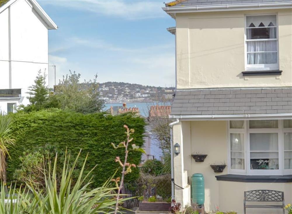 Large balcony overlooking the garden with sea views (photo 2) at Sea Peeps in Paignton, Devon