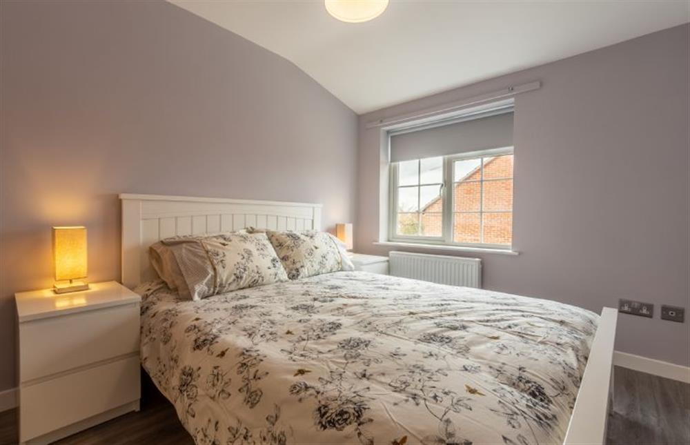 First floor: Bedroom two with a king-size bed at Sea Shanty Cottage, Wells-next-the-Sea