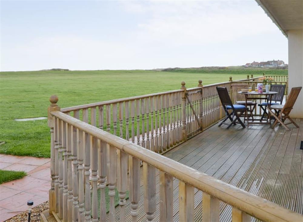 Decked terrace with outdoor furniture at Sea Space in Bacton, Norfolk