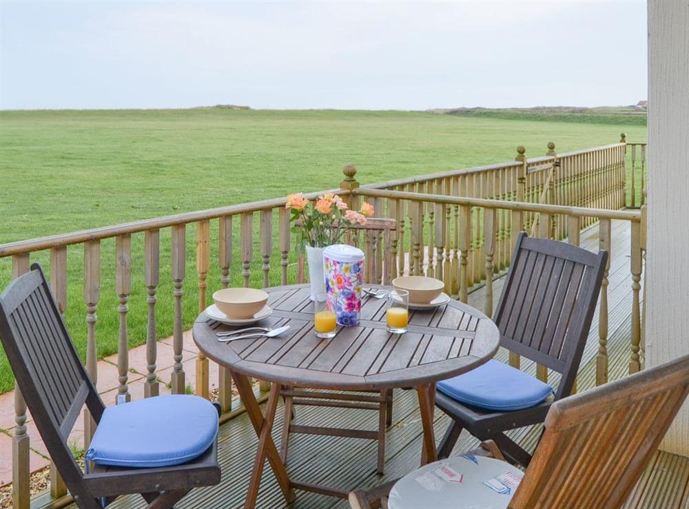 Outdoor seating area on the terrace at Sea Space in Bacton, Norfolk