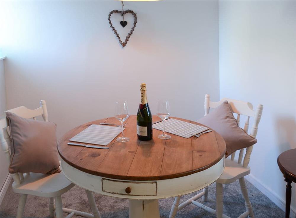 Cosy dining table and chairs at Sea Thistle Cottage in Nairn, Highlands, Morayshire