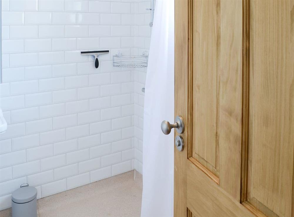 Shower room with open tiled shower area at Sea Thistle Cottage in Nairn, Highlands, Morayshire