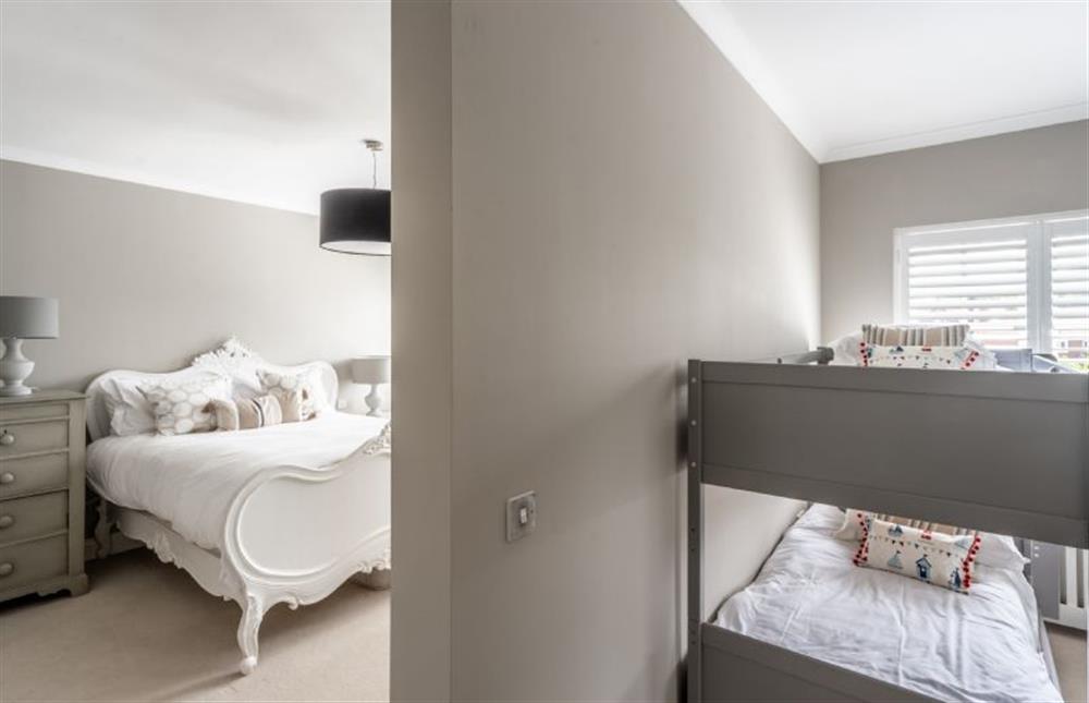 Bedroom two with 6’ superking-size bed and second area with adult bunk beds (photo 3) at Sea View Manor, Mundesley near Norwich