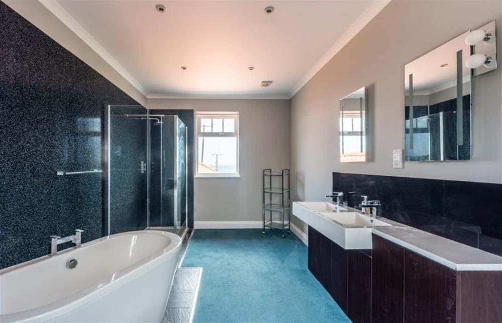 Family bathroom with bath and walk-in shower at Sea View Manor, Mundesley near Norwich