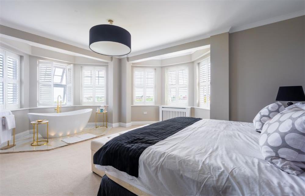 With 6’6 emperor bed, slipper bath in the bedroom, en-suite bathroom and with views out to se at Sea View Manor, Mundesley near Norwich