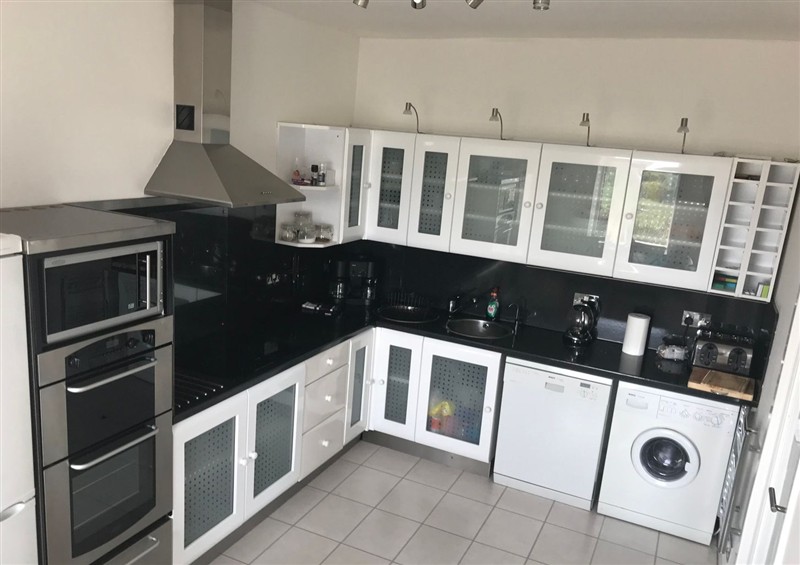 This is the kitchen at Sea Views No 8 Plas Darien, Trearddur Bay