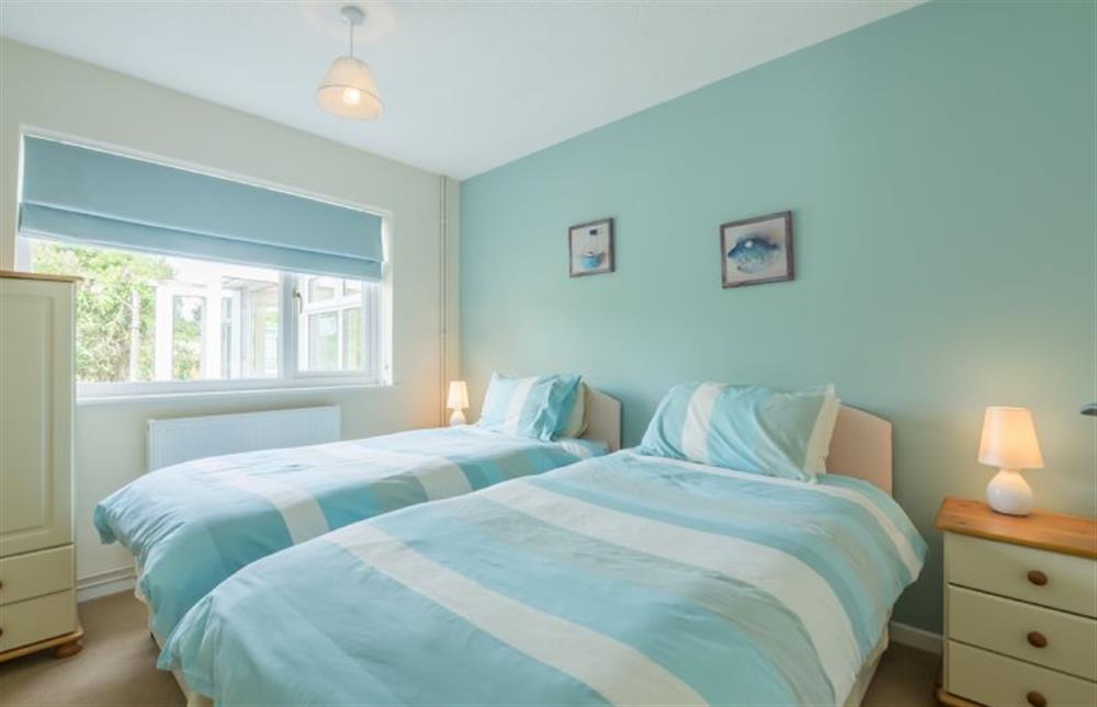 Ground floor: Bedroom two, twin room with full size single beds at Sea Wind, Brancaster near Kings Lynn