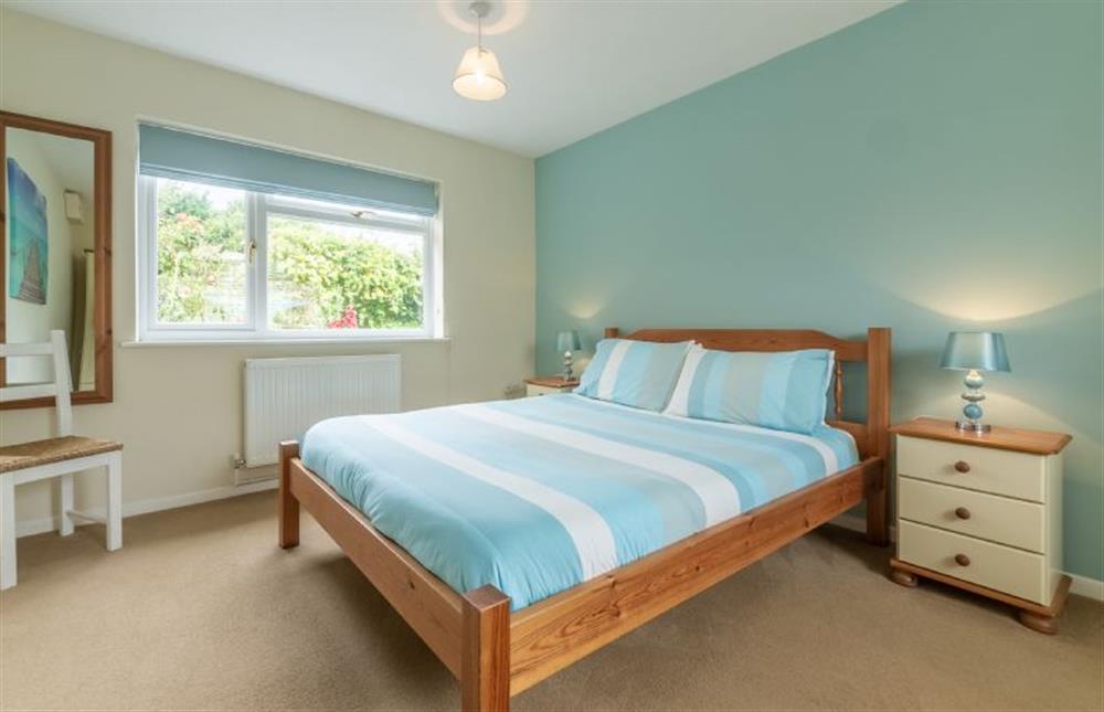 Ground floor: Master bedroom has king-size bed at Sea Wind, Brancaster near Kings Lynn
