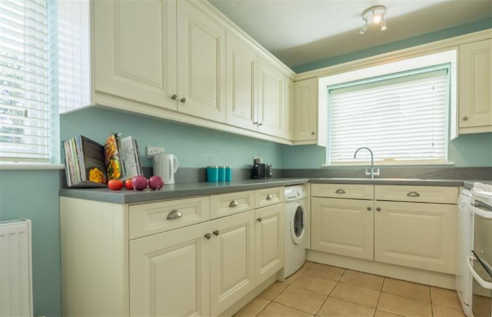 Ground floor: The fitted Kitchen also has a small table at Sea Wind, Brancaster near Kings Lynn