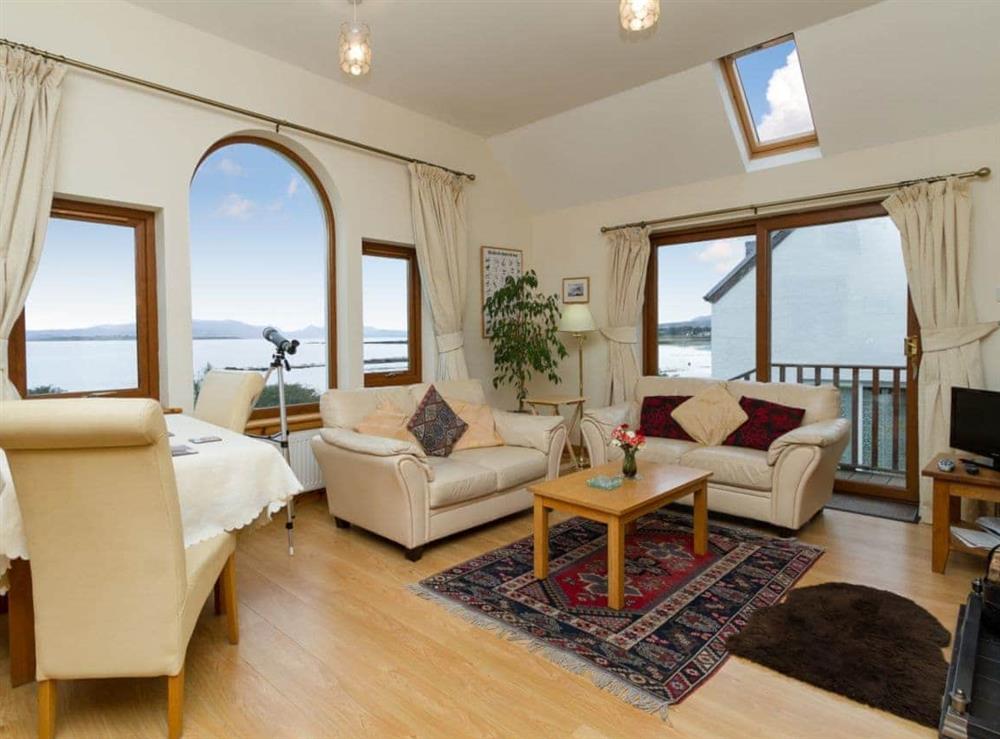 Open plan living space with magnificent views over Broadford Bay (photo 3) at Seabird Cottage in Broadford, Isle of Skye., Isle Of Skye