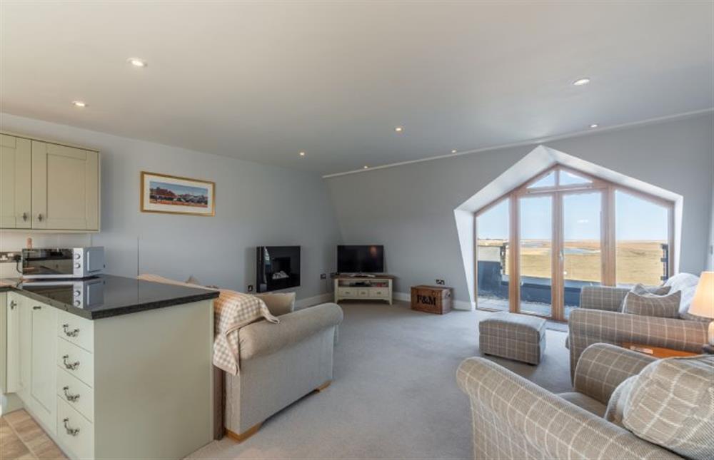 Sitting area looking towards feature french doors to balcony at Seaborne, Wells-next-the-Sea