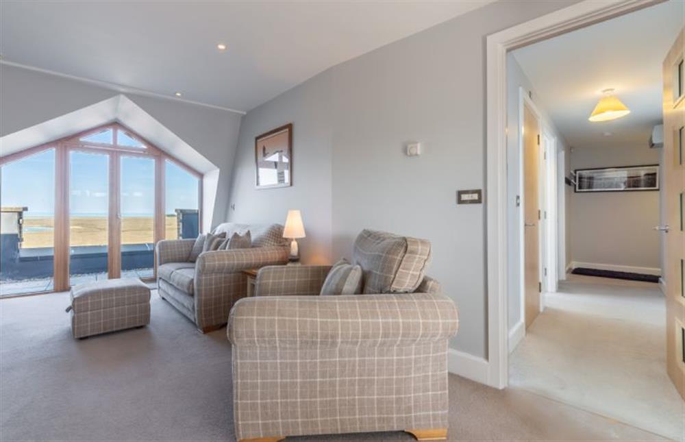 Sitting area with door leading to bedrooms at Seaborne, Wells-next-the-Sea