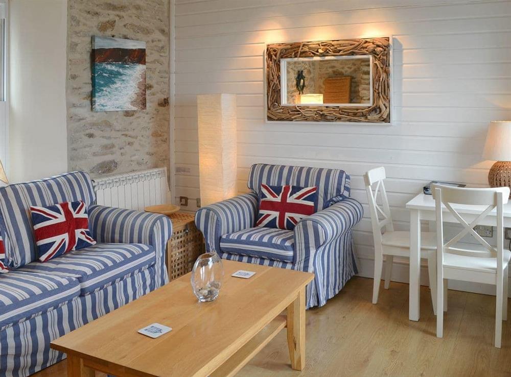Comfortable living/ dining room at Seacharm in Gorran Haven, Cornwall