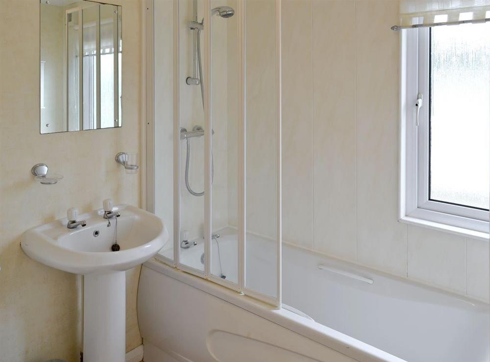 Family bathroom with shower over bath at Seacroft in East Runton, near Cromer, Norfolk