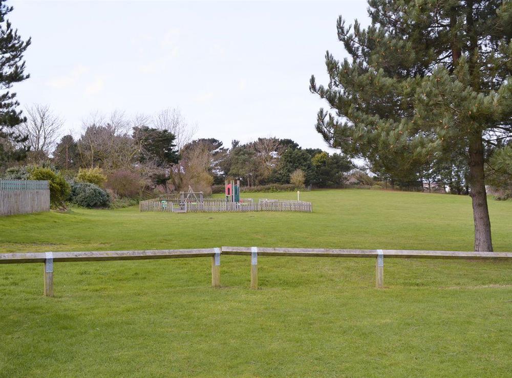 Open grassed area and children’s play facility