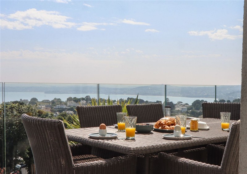 Enjoy a glass of wine on the patio at Seacroft, Wellswood near Torquay