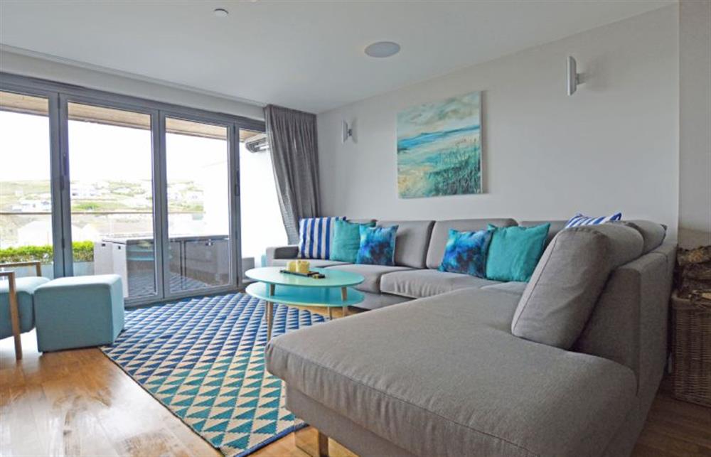 SeaEsta, Cornwall: Open-plan sitting area with bi-folding doors to a large balcony  at SeaEsta, Portreath