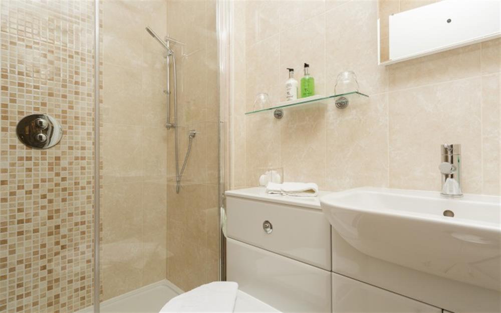 Bedroom 2' has an en suite shower at Seaflowers in Frogmore