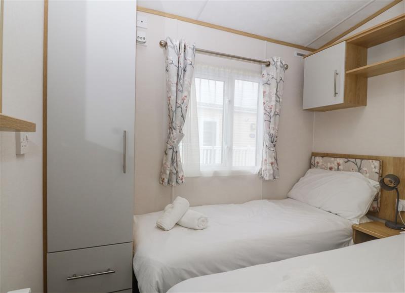 One of the 3 bedrooms at Seafront Holiday Home 1, Pwllheli