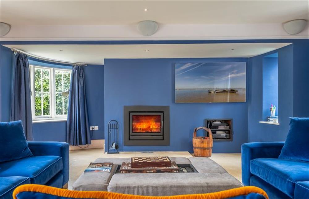 Sitting room with wood-burning stove and shuttle board