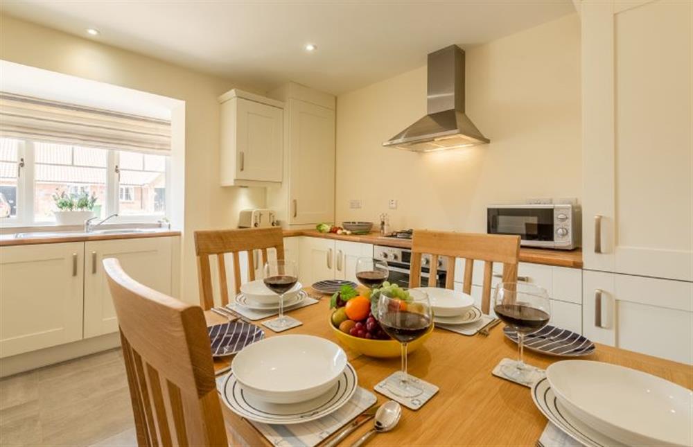 Ground floor:  Kitchen/dining room with table with seating for four at Seagrace, Heacham near Kings Lynn