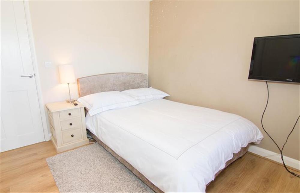 First floor: Double bedroom has en-suite shower room at Seagrass, Thornham near Hunstanton