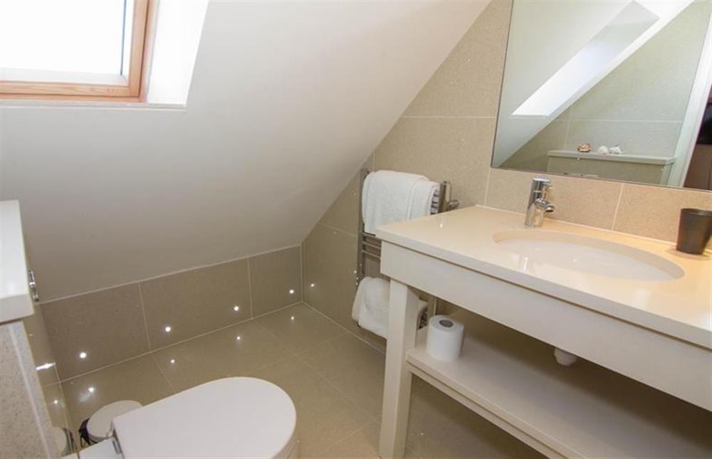 First floor: Stylish en-suite bathroom in Master bedroom at Seagrass, Thornham near Hunstanton