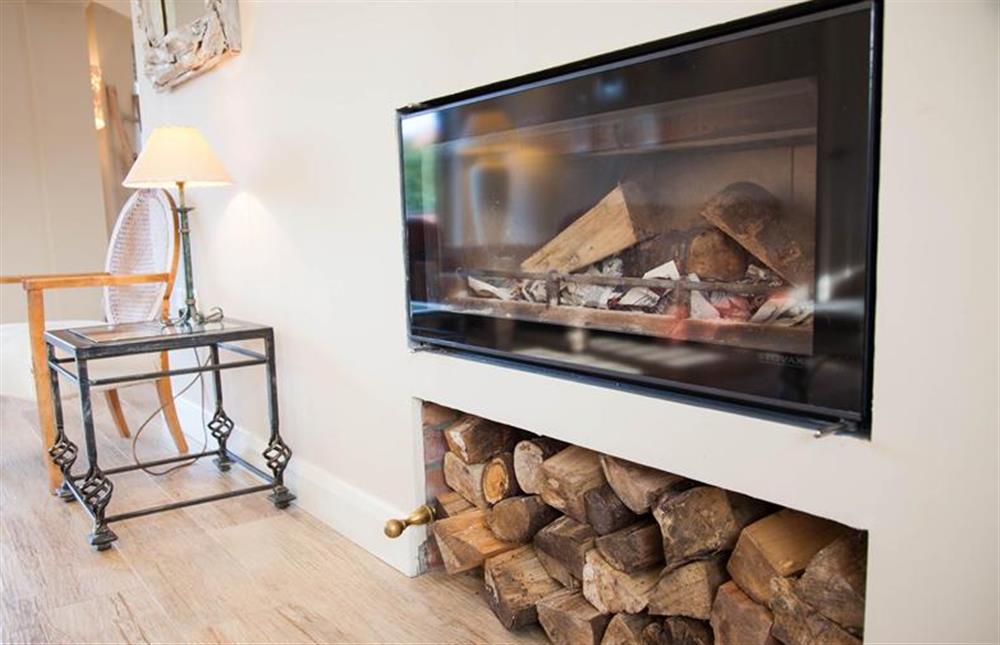Ground floor: Modern wood burning stove in the Sitting room