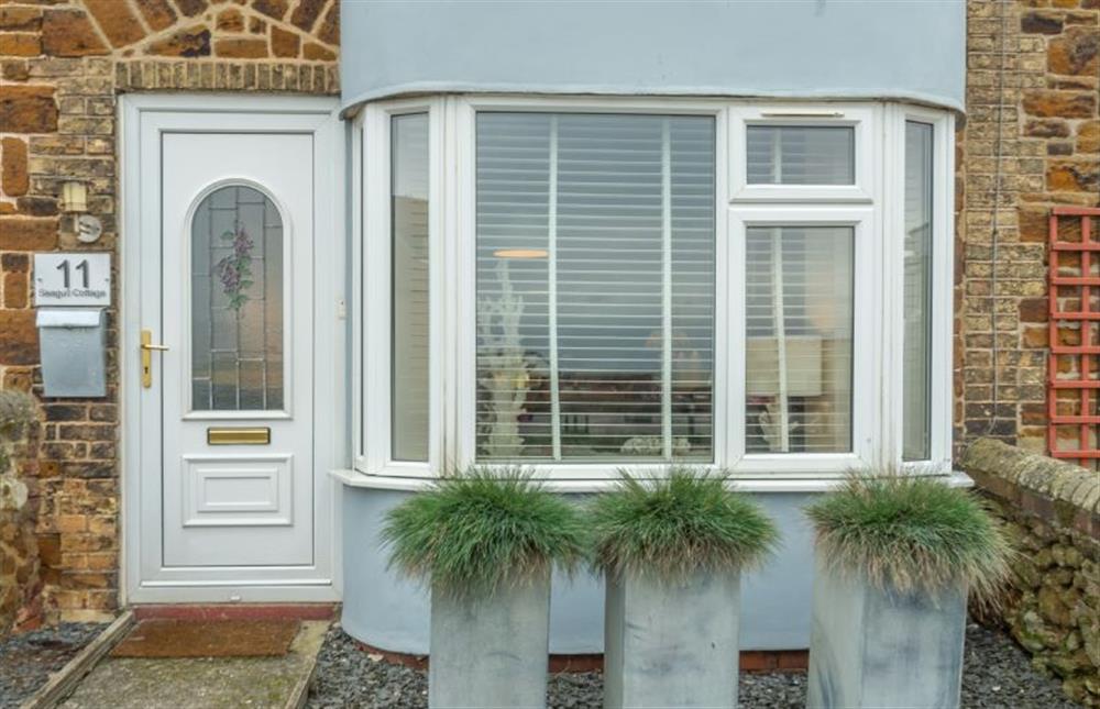 Exterior: The front garden is fully-enclosed at Seagull Cottage, Hunstanton